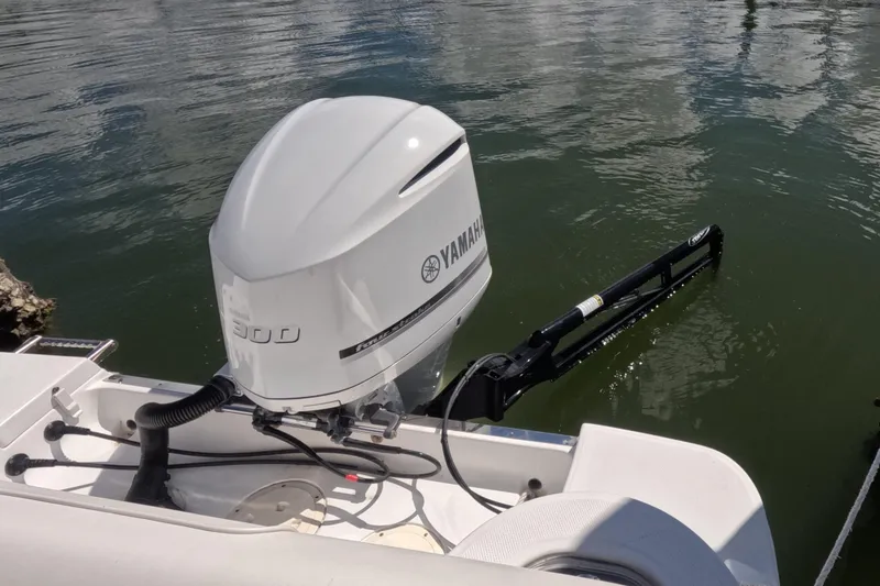 Slide: The Image of 2012 Robalo R247 Dual Console with Yamaha 300 outboard engine at marina. - 93