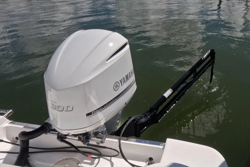 Slide: The Image of 2012 Robalo R247 Dual Console with Yamaha 300 outboard engine on water. - 94