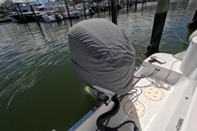 Slide: The Image of 2012 Robalo R247 Dual Console with Yamaha 300 outboard engine on water. - 95