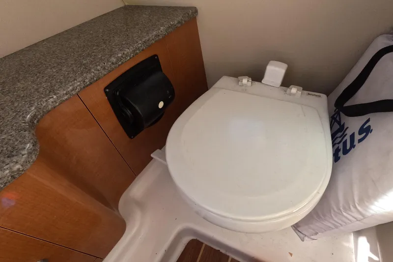 Slide: The Image of Control panel for Dometic vacuum pump on 2012 Robalo R247 Dual Console boat. - 99