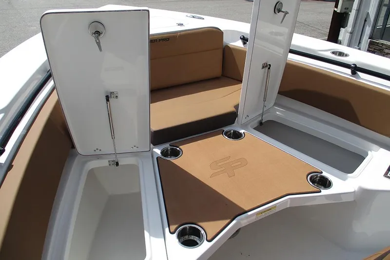 Slide: The Image of 2026 Sea Pro 225FLX Sandbar boat interior with storage compartments and seating. - 10