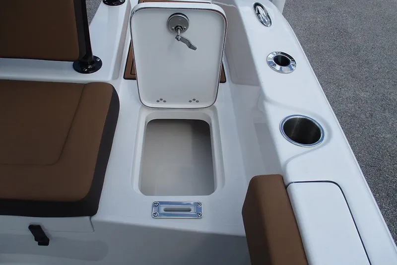 Slide: The Image of 2026 Sea Pro 225FLX Sandbar boat interior with storage compartment and cup holders. - 19