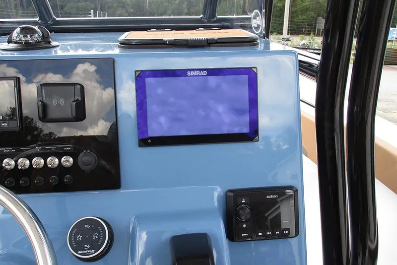 Slide: The Image of Dashboard of 2026 Sea Pro 225FLX Sandbar boat with Simrad display and controls. - 23