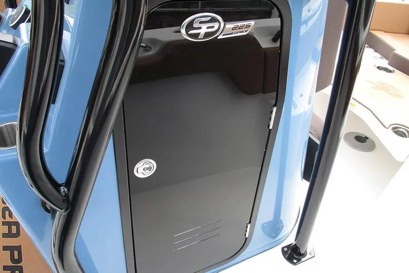 Slide: The Image of 2026 Sea Pro 225FLX Sandbar boat console with black door and logo. - 26