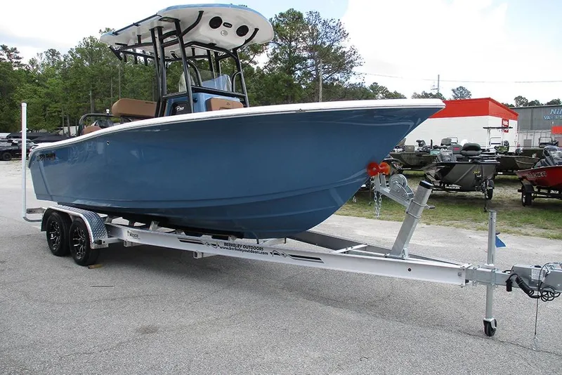 Slide: The Image of 2026 Sea Pro 225FLX Sandbar boat on trailer, parked outdoors. - 4