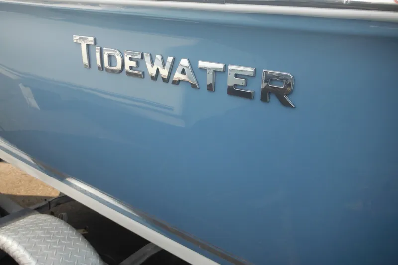 Slide: The Image of 2026 Tidewater 210 LXF boat with blue exterior and chrome logo. - 13