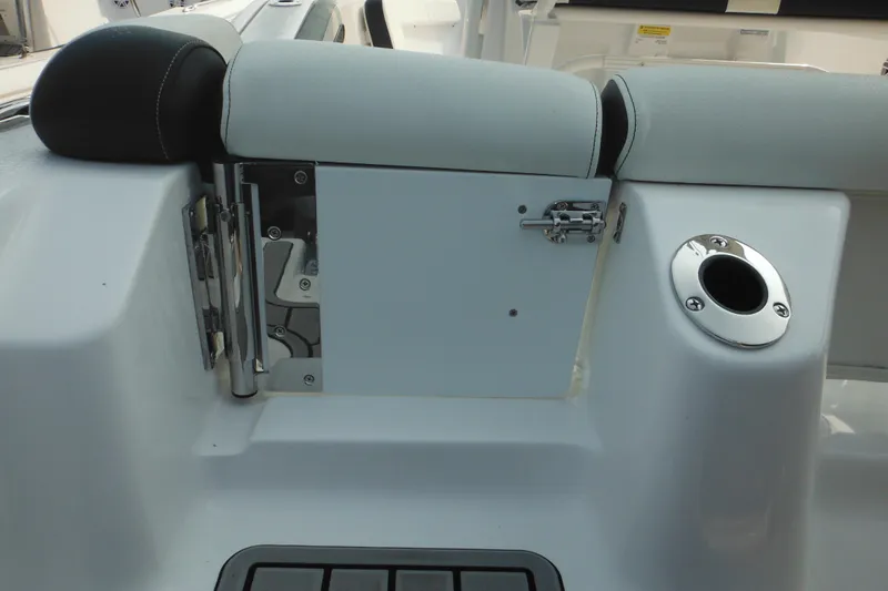 Slide: The Image of 2026 Tidewater 210 LXF boat interior with seating and storage compartment. - 14