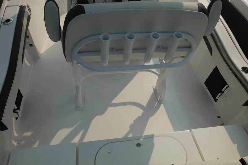 Slide: The Image of 2026 Tidewater 210 LXF boat interior with rod holders and seating. - 15