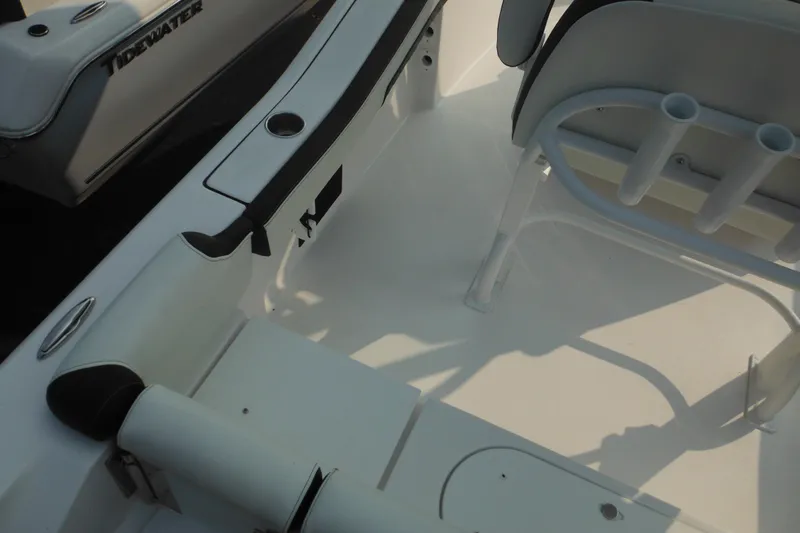 Slide: The Image of 2026 Tidewater 210 LXF boat interior with seating and rod holders. - 17