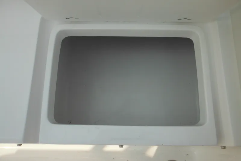 Slide: The Image of Storage compartment of 2026 Tidewater 210 LXF boat, open and empty. - 20