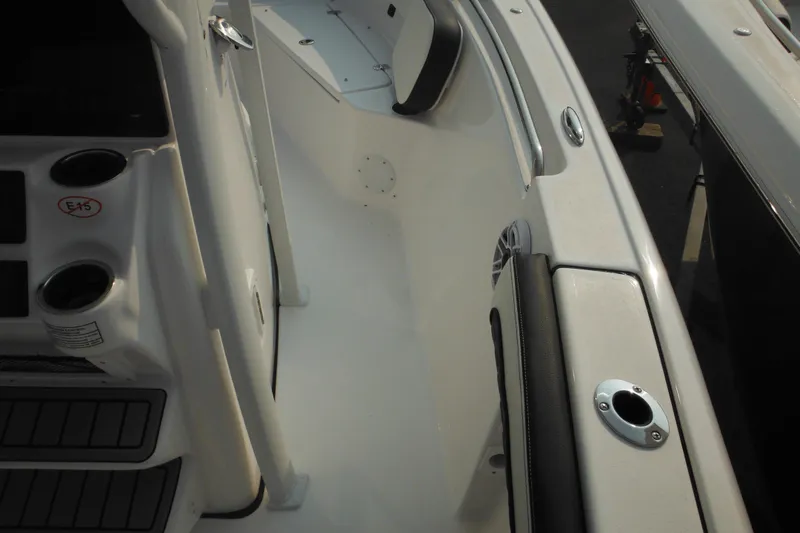 Slide: The Image of 2026 Tidewater 210 LXF boat interior with cup holders and seating area. - 26