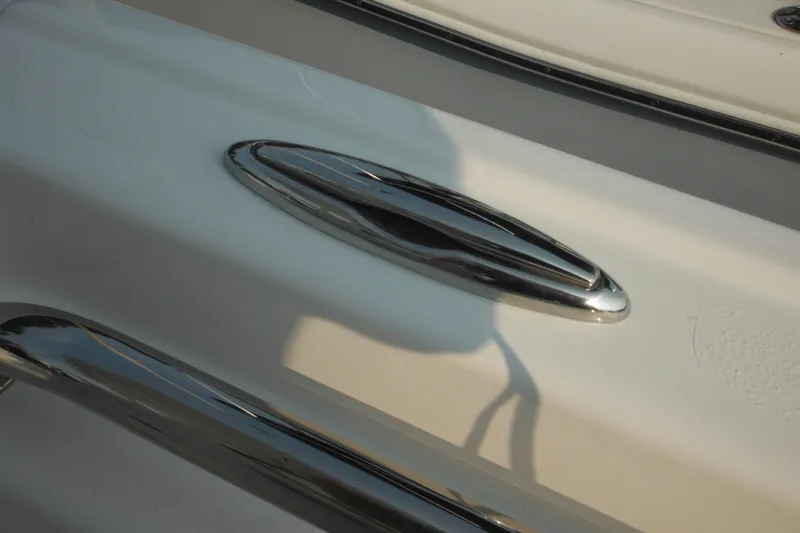 Slide: The Image of Close-up of 2026 Tidewater 210 LXF boat's sleek chrome cleat. - 30