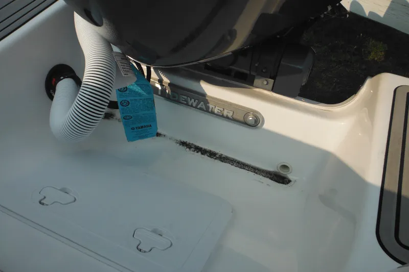 Slide: The Image of 2026 Tidewater 210 LXF boat interior with Yamaha engine components visible. - 32
