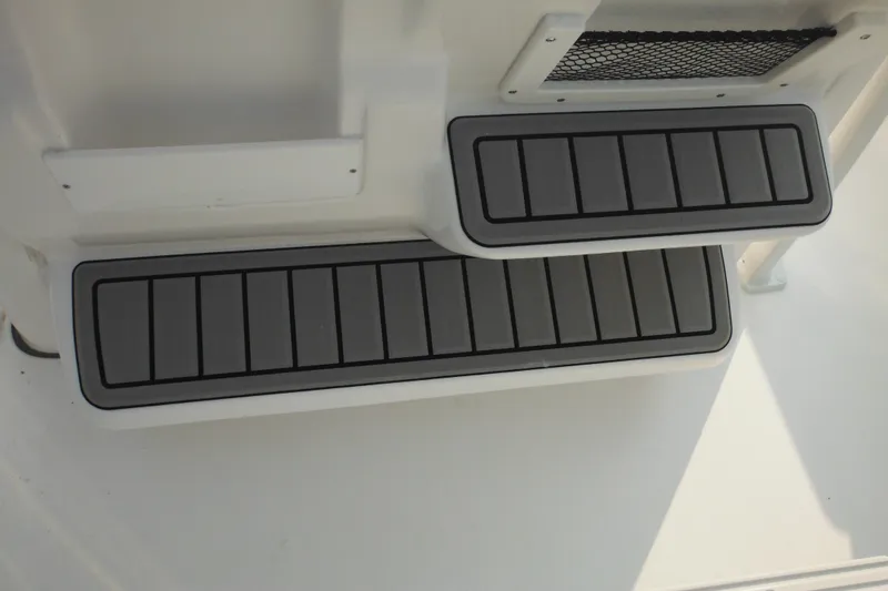 Slide: The Image of Tidewater 210 LXF 2026 boat steps with non-slip surface design. - 36