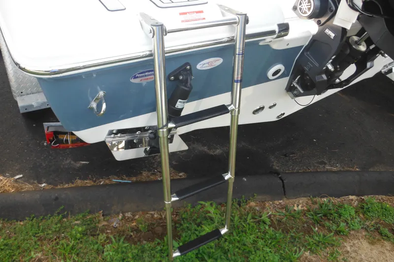 Slide: The Image of 2026 Tidewater 210 LXF boat with stainless steel ladder and outboard motor. - 4