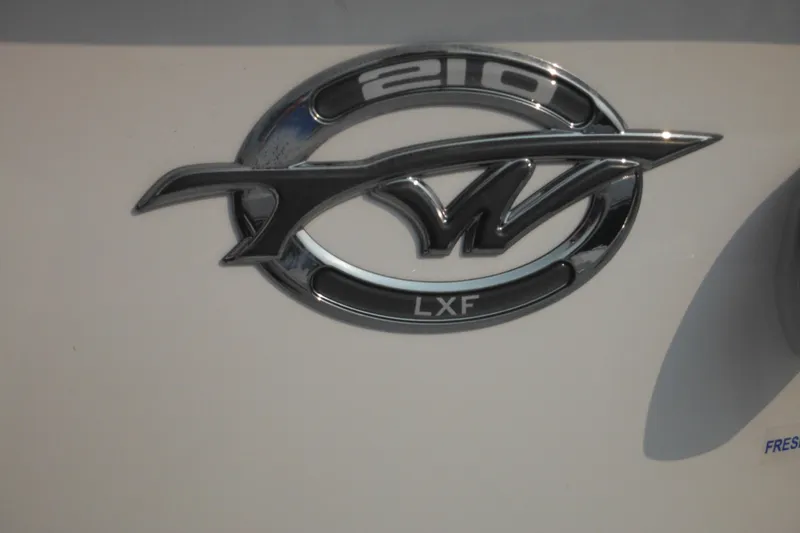 Slide: The Image of Tidewater 210 LXF 2026 model logo on a white surface. - 53