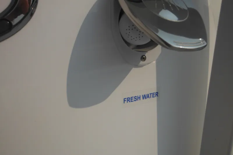 Slide: The Image of Fresh water access on 2026 Tidewater 210 LXF boat. - 54