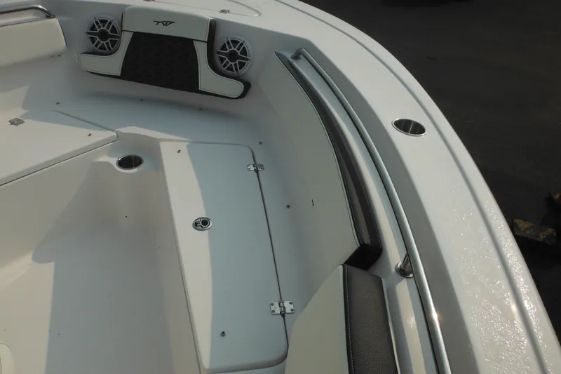 Slide: The Image of 2026 Tidewater 210 LXF boat interior with speakers and storage compartments. - 58