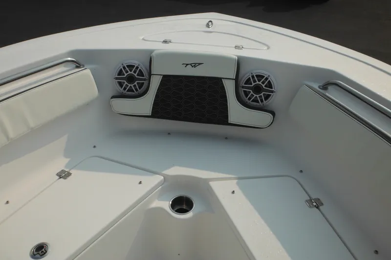 Slide: The Image of 2026 Tidewater 210 LXF boat interior with speakers and seating. - 59