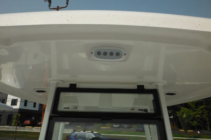Slide: The Image of Tidewater 210 LXF 2026 boat roof detail with integrated lighting and windshield. - 63