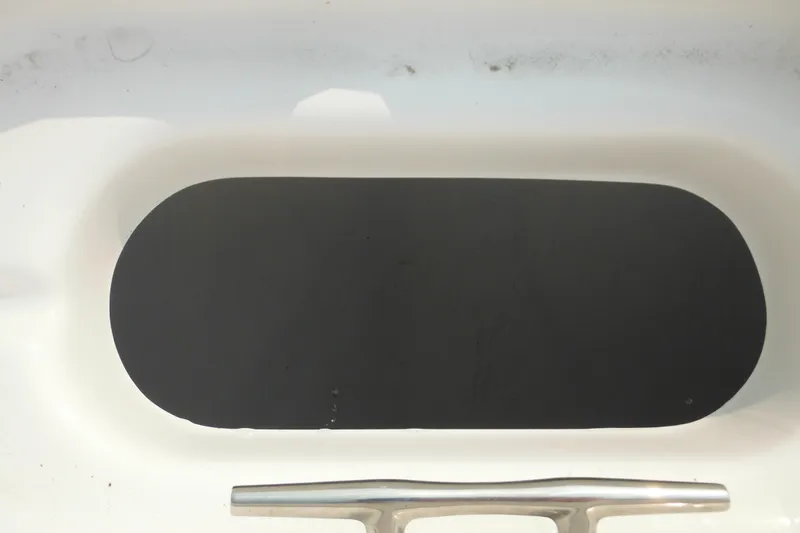 Slide: The Image of 2026 Tidewater 210 LXF boat detail with cleat and black non-slip surface. - 68