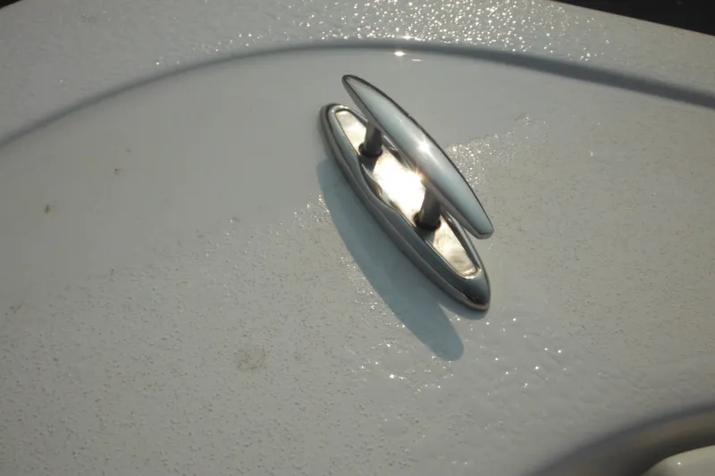 Slide: The Image of 2026 Tidewater 210 LXF boat cleat on textured white surface. - 69