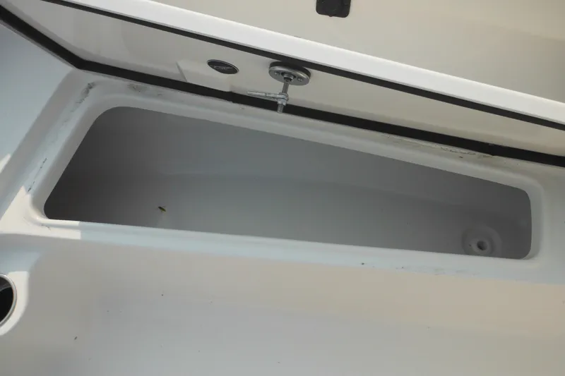 Slide: The Image of Storage compartment of 2026 Tidewater 210 LXF boat, open and empty. - 70