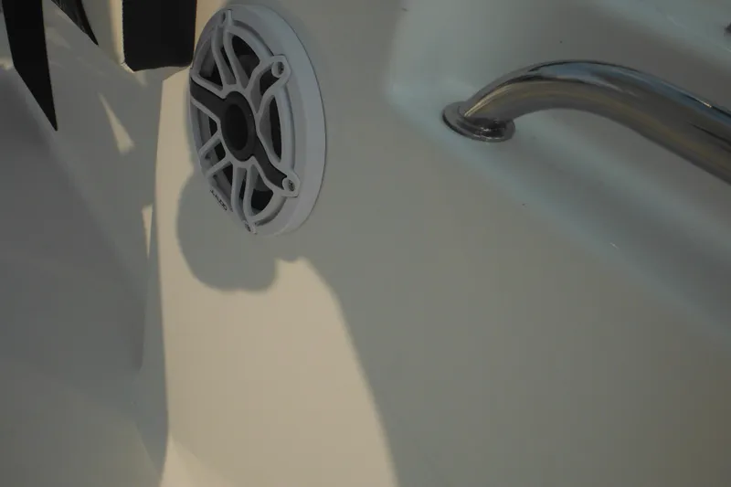 Slide: The Image of 2026 Tidewater 210 LXF boat interior with speaker and stainless steel handle. - 73