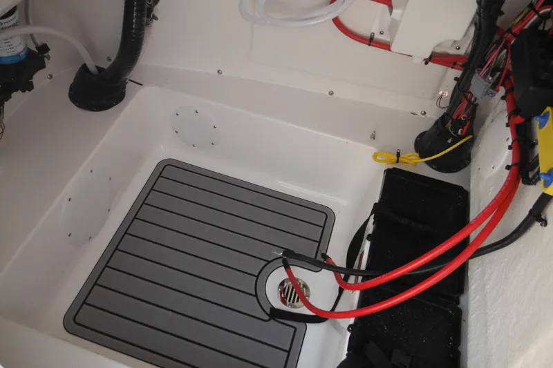 Slide: The Image of Interior view of 2026 Tidewater 210 LXF boat, showcasing wiring and flooring details. - 75