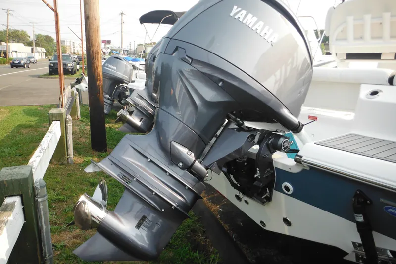 Slide: The Image of 2026 Tidewater 210 LXF boat with Yamaha outboard motor displayed outdoors. - 8