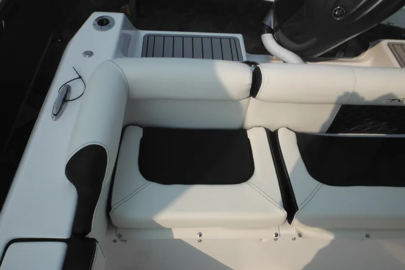 Slide: The Image of 2026 Tidewater 210 LXF boat interior with white and black seating. - 88