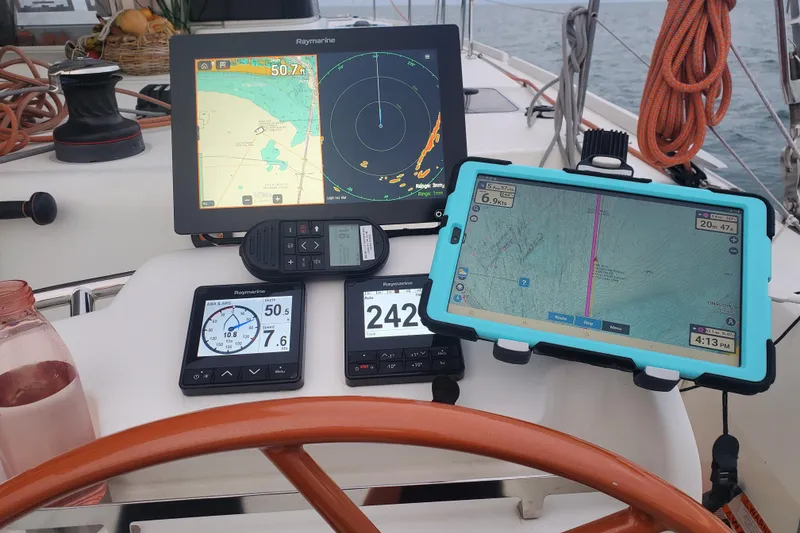 Slide: The Image of Sailing yacht Excess 12 cockpit with navigation screens and steering wheel, 2020 model. - 12