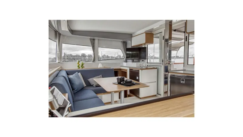 Slide: The Image of Luxurious interior of 2020 Excess 12 catamaran with modern seating and dining area. - 14