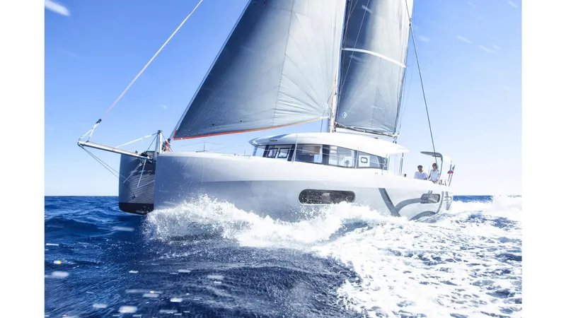 Slide: The Image of Sailing catamaran Excess 12, 2020 model, gliding on open sea under clear blue sky. - 20