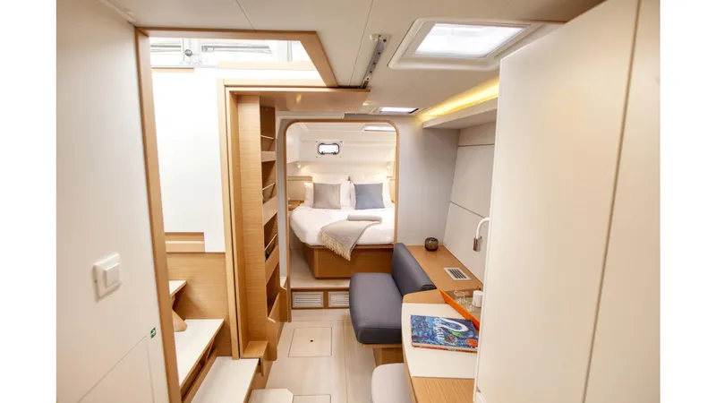 Slide: The Image of Interior of 2020 Excess 12 yacht, featuring cozy bedroom and modern seating area. - 7