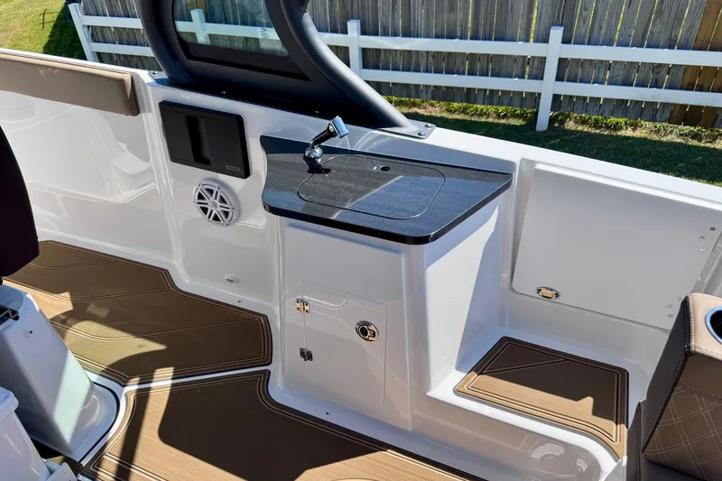 Slide: The Image of 2026 Monterey Elite 27 OB boat interior with sleek design and modern amenities. - 10