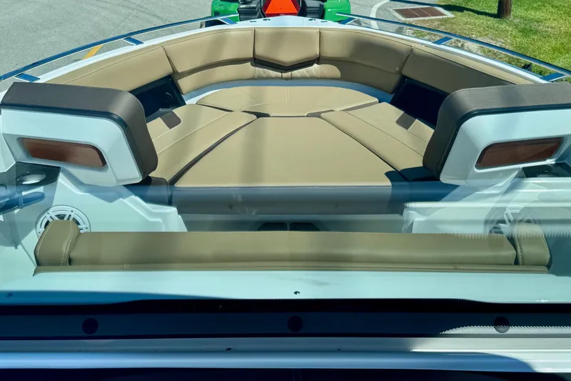 Slide: The Image of Luxurious seating on the 2026 Monterey Elite 27 OB boat, featuring tan upholstery. - 16