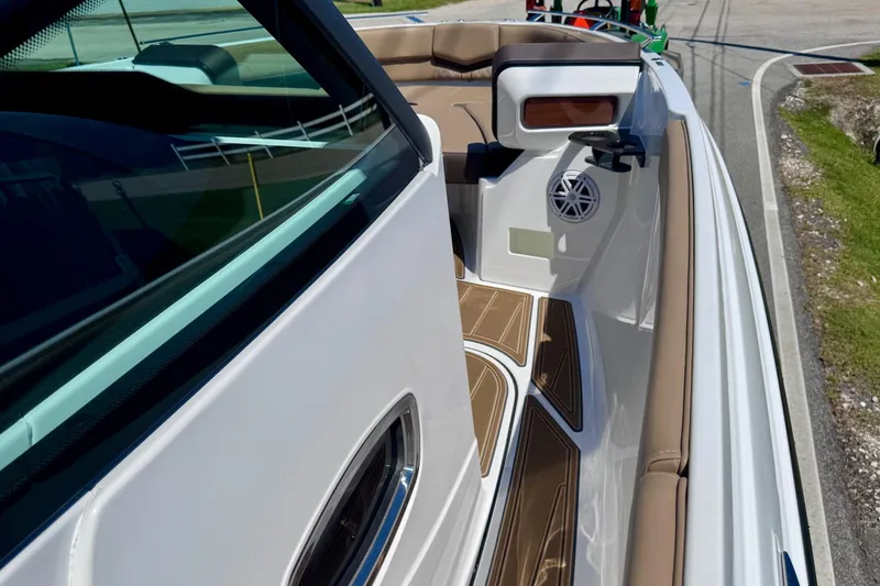 Slide: The Image of 2026 Monterey Elite 27 OB boat interior with tan seating and modern design. - 17