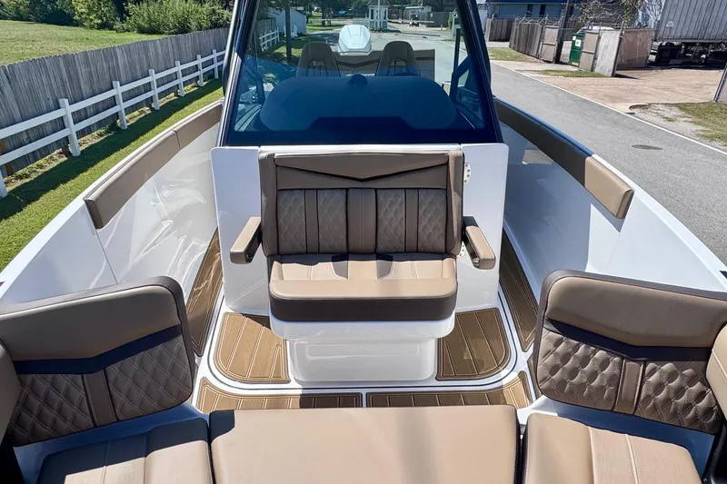 Slide: The Image of 2026 Monterey Elite 27 OB boat interior with luxurious seating and modern design. - 18