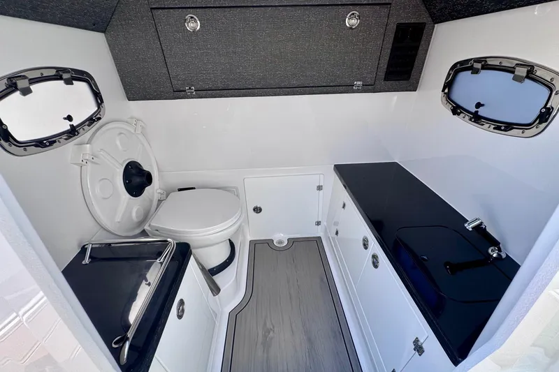 Slide: The Image of 2026 Monterey Elite 27 OB boat interior with modern bathroom amenities. - 19