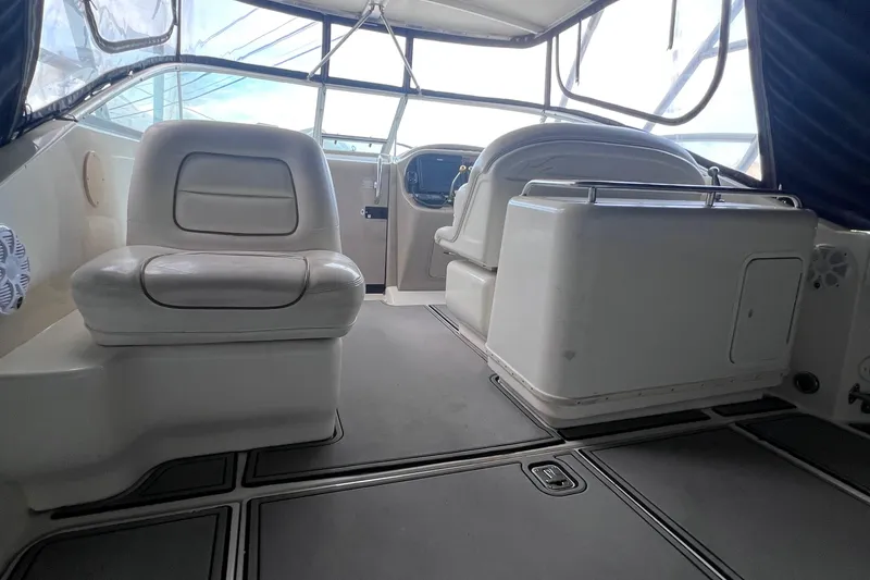 Slide: The Image of 2000 Sea Ray 290 Amberjack boat interior with seating and helm. - 11
