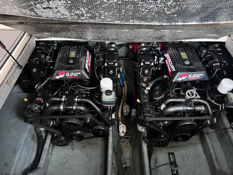 Slide: The Image of Twin engines of a 2000 Sea Ray 290 Amberjack boat, showcasing 5.0L MerCruiser power. - 22