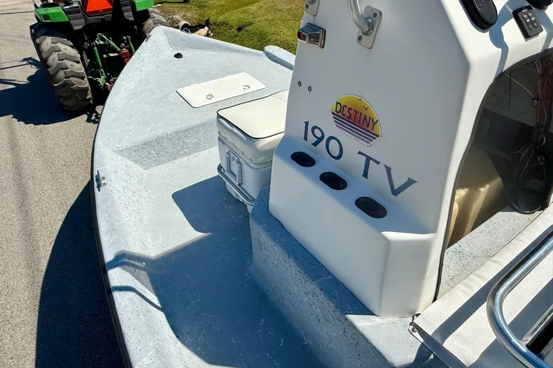 Slide: The Image of Boat interior of 2004 Destiny 190 TV with seating and control panel. - 11