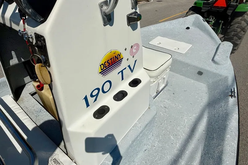 Slide: The Image of 2004 Destiny 190 TV boat interior with control panel and seating. - 13