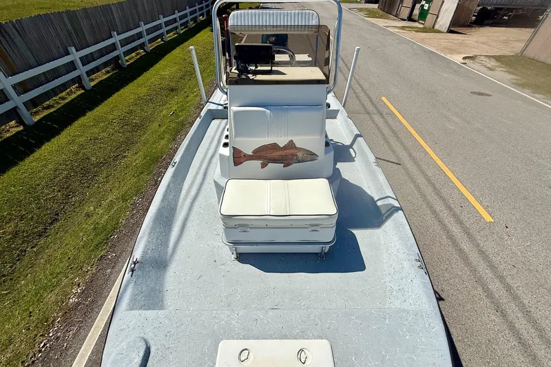 Slide: The Image of 2004 Destiny 190 TV boat on road, featuring a fish decal and white seating. - 14