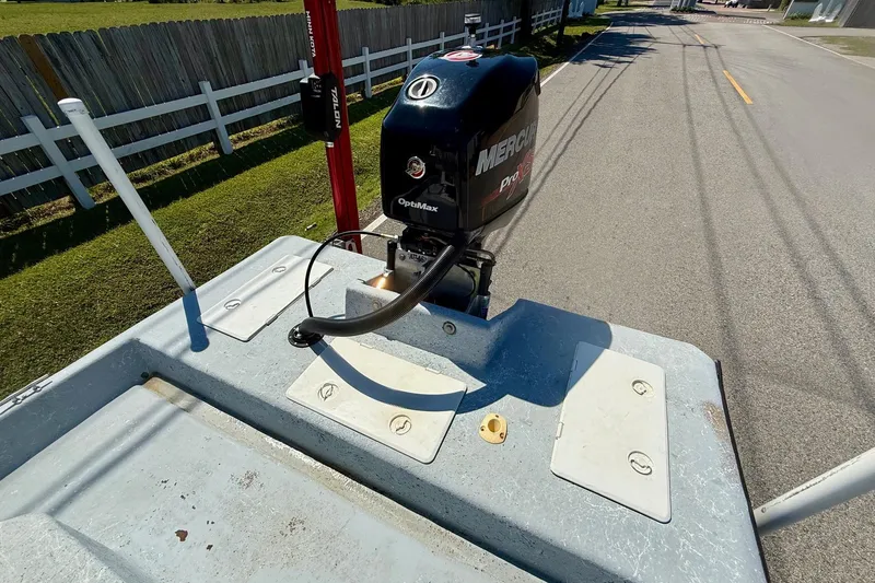 Slide: The Image of Boat with Mercury Pro XS engine on a Destiny 190 TV, 2004 model, parked on a road. - 7