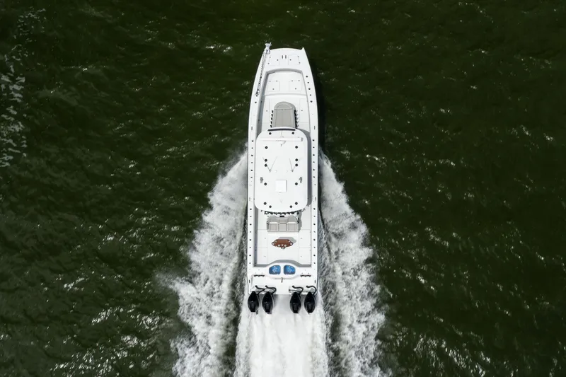 Slide: The Image of Aerial view of 2025 Freeman 42 LR boat cruising on water. - 18