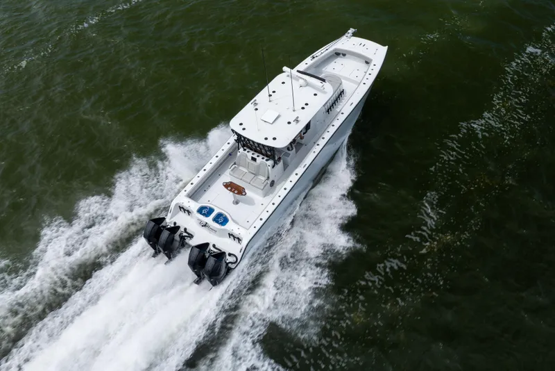 Slide: The Image of Aerial view of 2025 Freeman 42 LR boat cruising on water. - 19