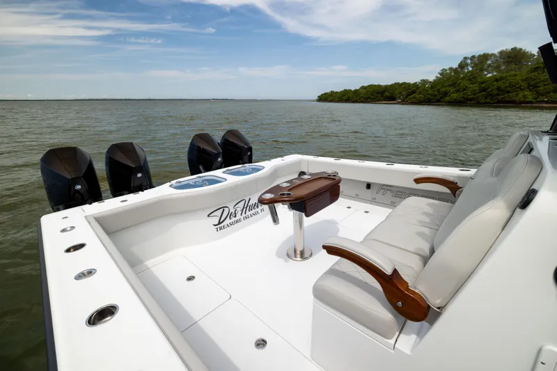 Slide: The Image of Luxury Freeman 42 LR boat interior, 2025 model, with plush seating and multiple outboard engines. - 22