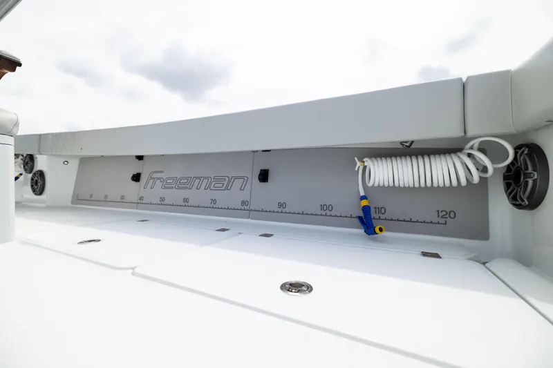 Slide: The Image of Freeman 42 LR 2025 boat deck with measuring scale and coiled hose. - 28